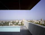 Khanna and Schultz introduced a deep, cantilevered overhang to the owner's terrace, which has a pool and a view of the city and the Arabian Sea.  Photo 16 of 17 in A Modern Aesthetic in Mumbai