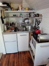 And here's the kitchen on a typical day. Clutter is practically unavoidable when your kitchen is a Lilliputian nook.