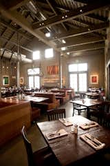 The dining room is dominated by large tables and booths meant to emulate a farmhouse aesthetic. The designers looked locally and found lounge tables at Roost in Sausalito; communal tables and dining table tops from reclaimed-wood furniture-maker The Wooden Duck in Berkeley; and dining table bases, booths, and banquettes at West Coast Industries in San Francisco.