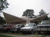 The sides of the building used to be open, but this auto service shop is a Dow design is of Styrofoam and concrete.