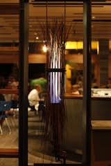 The floating lobby fireplace, created by the Alameda-based artist Leonidas Kyriakopoulis, is made from bound copper Steinway piano wires.