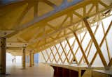 This centerpiece is also being repurposed as a drawing studio. Built by carpenters Spazio Legno of Venice, it has become a site for lectures, discussions, and drawing classes for both visitors and Venetian school children. Here, we see the underside of the 'stadium', showcasing the structural wooden trusses cut by CNC.  Photo 5 of 15 in Venice Biennale: National Pavilions 1 by Tiffany Chu