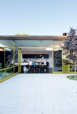Outdoor, Back Yard, Large Patio, Porch, Deck, and Pavers Patio, Porch, Deck Unable to alter the footprint of the building, the Deams created a backyard living area that nearly doubled the home's living space.  Search “modern french design normal studio” from Designed In-House