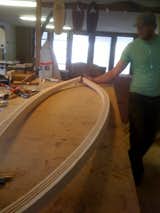 Hess builds surfboards "similar to how guitars are made: from the inside out." He uses materials like salvaged redwood and poplar, and intends for them to last ten times longer than those made of foam and fiberglass. He calls his a "more sustainable approach to surfboard-building."  Photo 7 of 14 in Inside Woodshop by Jaime Gillin