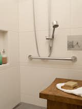 The shower can accommodate two, and has Hansgrohe heads of differing heights with separate controls from Cifial. The residents stayed away from a built-in bench and opted to switch out a variety of tables and benches as needed, to avoid dealing with the mold or water stains that quickly materialize in a built-in. Tile from Statements.