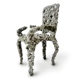 The Molecular chair looks as though it's made of just that: molecules blown up millions of times, hanging onto each other in waving strands. The "molecules" in this case are felt balls attached to a wire mesh frame. Photo courtesy of Industry Gallery.