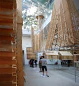 On the other side, a set of sculptural, geometric hangings are suspended from the atrium.
