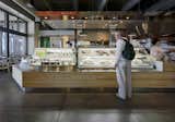In Japan, Rock Field is the largest prepared food company, offering its good at its RF-1 take-out shops. With the help of a recommendation from Chez Panisse-founder Alice Waters, who had worked with Rock Field to develop new salad recipes, the company acquired a corner space in the renovated Ferry Building in which to launch its first U.S. shop. The prepared foods--such as wasabi potato salad and its kobe beef sushi--are handsomely displayed in food cases developed by Rock Field in Japan and delivered to the Ferry Building for this project. Photo by Joe Fletcher.