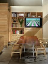 Though the space originally included a dining table at one end, the popularity of the restaurant and space needs pushed it out. The company cut the table in half and affixed half of it to the far side of the food counter to create a sushi bar. Photo by Cesar Rubio.