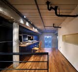 The addition of a loft increases square footage, providing a larger, more private office/workspace.