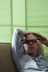The illustrator Richard Haines relaxing in his Bushwick apartment.  Photo 5 of 16 in An Afternoon with Michael Mundy by Bradford Shellhammer