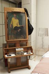 A portrait works as a coatrack in Zenou's bedroom.