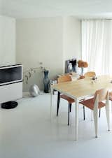 Architect Makoto Tanijiri’s firm custom-designed most of the furniture in the building, including the steel-and-paulownia dining table.  Photo 6 of 12 in Kitchen from Small Space Live/Work Box Home in Japan