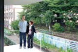 Without a garden of their own, Takuya and Yurika enjoy the verdant view of the schoolyard cherry trees next door from their bedroom balcony.