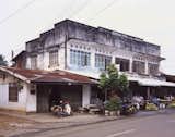 This building is fairly common in Vientiane, with the storefront at the bottom and living quarters in back and on top.  Photo 13 of 14 in Living in Laos