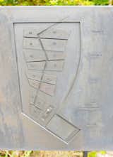 The layout of the site appears as a free form drawing in concrete.