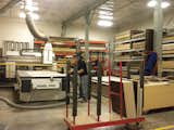 In SoDo, Henrybuilt's headquarters backs onto its 40,000-square-foot manufacturing facility. Once designs are complete, the wood is hand-selected so grains will match across the pieces and the patterns will flow from panel to panel. Here, wood is cut on the CNC machine.