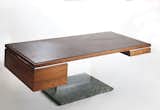 A 500-pound executive status symbol? Yes, in the form of a $6,000 leather, wood, and bronze desk designed by Platner. “I thought of these things as trees,” he said.