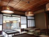 Inside the restaurant/teahouse. Sticotti designed the wooden tables, stools, and lighting fixtures.