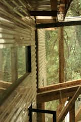 With the clear plastic cladding, “not only is the wood not in contact with the rainwater, it looks like a part of the forest with the trees’ reflection on it,” says Cano. All told, the property measures about 5,000 square feet. Photo courtesy T3arc