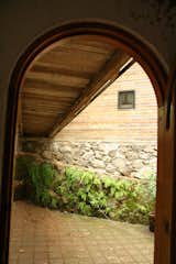 The boxy lines of the addition are a complement to the traditional arched doorway to the first-floor main entrance of the house. Photo courtesy T3arc