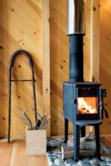 The diminutive Morsø wood stove and its hearth of local Criehaven beach stone gives off enough heat to warm the entire cottage.