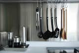 In order to compensate for the storage space given over to the oven and microwave, the Seahs added a metal bar to hang spoons, spatulas and tongs.