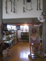 Here you can see into the nook off the main space. A painting by Rivera is shown as well as some shelves for the his collections of dolls and other crafts.