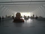 Here's a snap of the interior replete with the Olmec heads on display. The Pavilion was designed as an exhibition space, and thus seeks little more than to control the degree of light coming in and make itself available to a variety of uses. The two other shows displayed European clothing from 1715-1900 and then some 18th and 19th century pieces from the Resnick collection. All told, the building is not in any kind of competition with what's inside it, which I for one really appreciate.