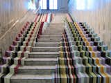 Stuart Haygarth is well known for his masterful repurposing of detritus, and for his installation at the V&A has transformed a banal staircase into an explosion of color using over 600 meters of cut-off pieces from picture frames supplied by bespoke framer John Jones.