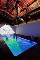 “The idea of experiencing art with all our senses is really embodied in this particular installation,” Ruiz comments in reference to Cosmococa - Programa in Progress, CC4 Nocagions, which features a heated swimming pool, dramatic lighting, projections of John Cage’s cocaine covered book, and his music in the background. Created by the late Brazilian artist Hélio Oiticica and filmmaker Neville D’Almeida, museum-goers are encouraged to don their swimming trucks, experience the sensorial effects of water, and thus, become part of the artwork itself. Photo by Iwan Baan
