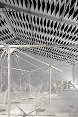 The 24 seats fashioned from netting hang mid-air and are suspended by a metal frame. "When we were shown [Grcic's] early renderings for Netscape, it was clear he understood the spirit of the space," says Granger.  Photo 2 of 7 in Design Miami's Deconstructed Tent  by Diana Budds