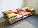The cushioned sofa was originally a project in which Högner made a sofa from sandbags. This iteration takes the sofa's smallest component--the pillow--and builds up.  Search “professor acorn pillow” from Kind of New