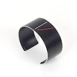 An old camera lens is upcycled into a fashionable cuff.  Photo 2 of 3 in Revisioning Camera Lenses