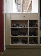 By the door, shoes get organized on a built-in by JKK Woodcraft.