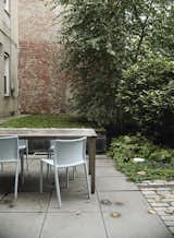 A quartet of Jasper Morrison Air Chairs for Magis provide outdoor seating.