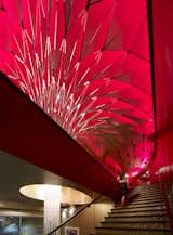 The Conga Room in Los Angeles, California. Designed by Belzberg Architects. Winner of the 2011 Institute Honor Award for Interior Architecture. Project description: "In an effort to meet the clients aesthetic desires for a ceiling that reflected the vibrancy and dynamism of the Latin culture, a pattern was developed made of diamonds from the rumba dance step. The ceiling also boasts a state of the art LED lighting system, which required lighting analysis and optimization, using various building performance software. Patrons ascend the staircase wrapped around this glowing spectacle  Its pattern morphs into the pedals and flowers, and responds to the varying conditions of program and space."