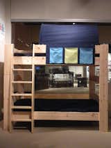 Shown here is Popsicle Furniture's HighSleeper, configured with two twin beds and a spacer along with its Cave topper.
