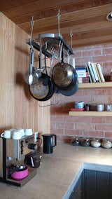 Our pot rack, espresso machine, cookbooks and jarred ingredients make the kitchen part lab, part library.