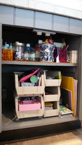 An entire cabinet of the kitchen is dedicated to art materials for our daughter, all arranged for her to reach.