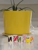 Graphic designer and illustrator Lotta Kühlhorn is a Dwell favorite. Though much of her talent goes toward creating book covers, her work also graces bolts of playful fabric for Ikea and products such as these Pear mugs for Koloni Stockholm. The yellow planter is designer Nina Jobs's Pandora pot for Nola.