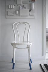 In the entryway, a plastic Uten.Silo organizer by Vitra shelters keys and other bits of potential clutter. A white-painted cafe chair suits the minimalist color scheme.  Photo 8 of 30 in Things by Marie-Philippe Bergeron from Fine Finnish