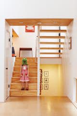 Just inside, Pippa, one half of the ever-entertaining twins, goofs around on the stairs leading from the entrance to the main floor and the bedrooms below.  Photo 1 of 4 in Stairs by Richard Docter from A New Slant