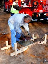 After the concrete is poured, the supportive pile is capped with a metal plate, a process which takes expert precision. Photo ©2011 epic software group, inc.