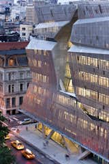 A jagged cut in the screens defines one facade of Morphosis's 41 Cooper Square in New York City.
