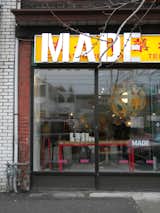 Located on Dundas Street West, Made opened in 2005 with Shaun Moore and Julie Nicholson at its helm. Setting up shop in a former Chinese herb dispensary, the owners opted to leave the original signage in place and overlay the colorful design with their own nameplate. "Rather than impose a shiny new showroom and a sharp new sign, we preferred to integrate into the streetscape—but with our own spin," Nicholson says.  Photo 1 of 13 in Made Design Shop and Gallery by Miyoko Ohtake