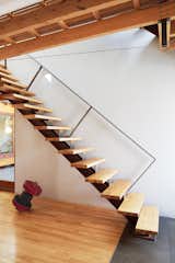 Keep Right

To eliminate flex in the cantilevered stairs, Bernier placed the structural stringer off-center. “When you climb the stairs and hold the rail, you actually step closer to the inside edge,” he says. He also located the handrail against the wall to keep it from visually interrupting the living room. The custom metalwork is by Félix Lepage.

felixlepagedesign.com

Don't miss a word of Dwell! Download our  FREE app from iTunes, friend us on Facebook, or follow us on Twitter!