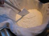 Joanne's homemade ricotta cheese draining in cheesecloth.  Search “Dish-Drainer.html” from Fresh and Baked Ricotta