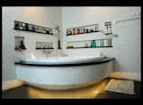 The bathroom is finished with a custom-made natural white and black marble mosaic.  Photo 8 of 12 in Bridging Old & New in Indonesia by Jaime Gillin