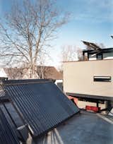An array of solar thermal tubes crowns the garage, and photovoltaic panels extend like wings over the third-floor deck. “If we were going to make a big architectural move, we had to have reasons,” Moore explains, referring to the conspicuous placement of the panels.